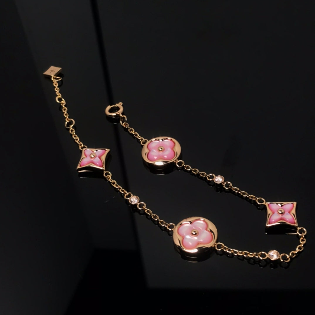 [Cyra]  STAR AND SUN 4 MOTIF PINK MOP PINK GOLD BRACELET