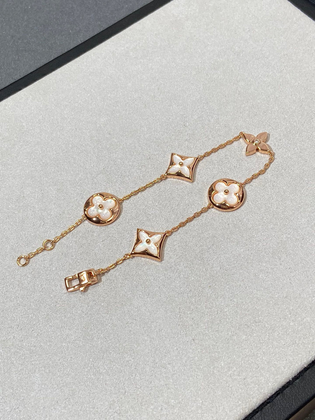 [Cyra]  STAR AND SUN 5 MOTIF MOP PINK GOLD BRACELET