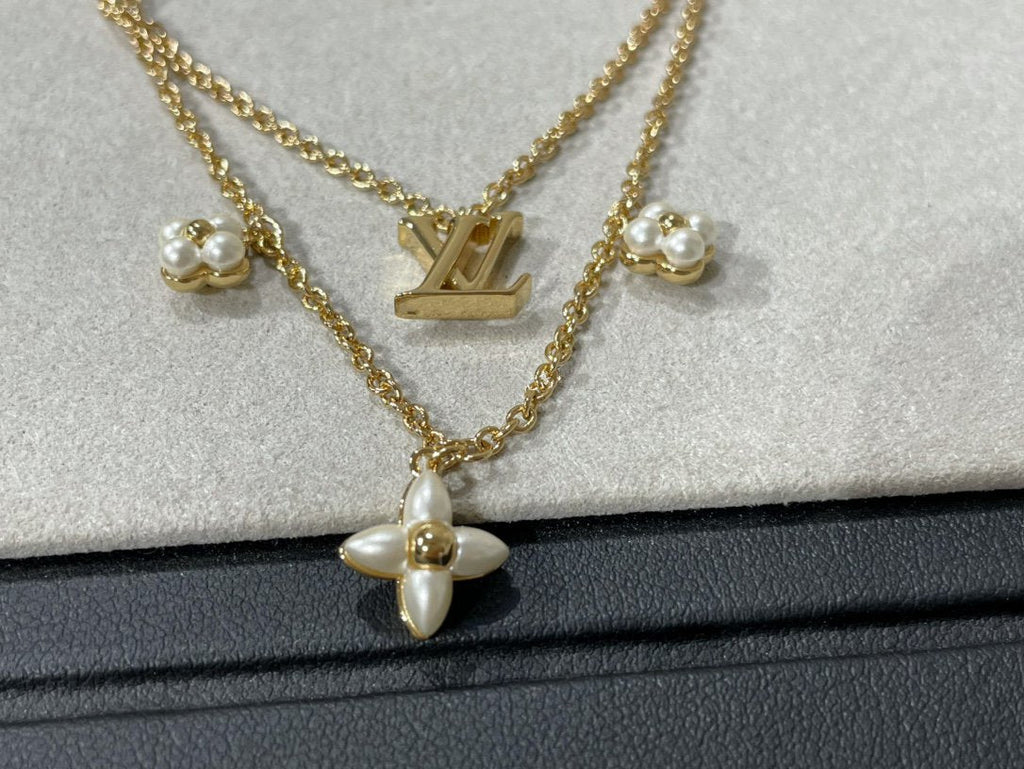 {
  "Cyra": "FLOWERGRAM GOLD MOP DOPPELREIHIGE HALSKETTE"
}