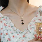 [Cyra] KETTE AUS ONYX, ROSÉGOLD MIT STERN UND SONNE